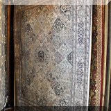 R10. Hand knotted Oriental rug.